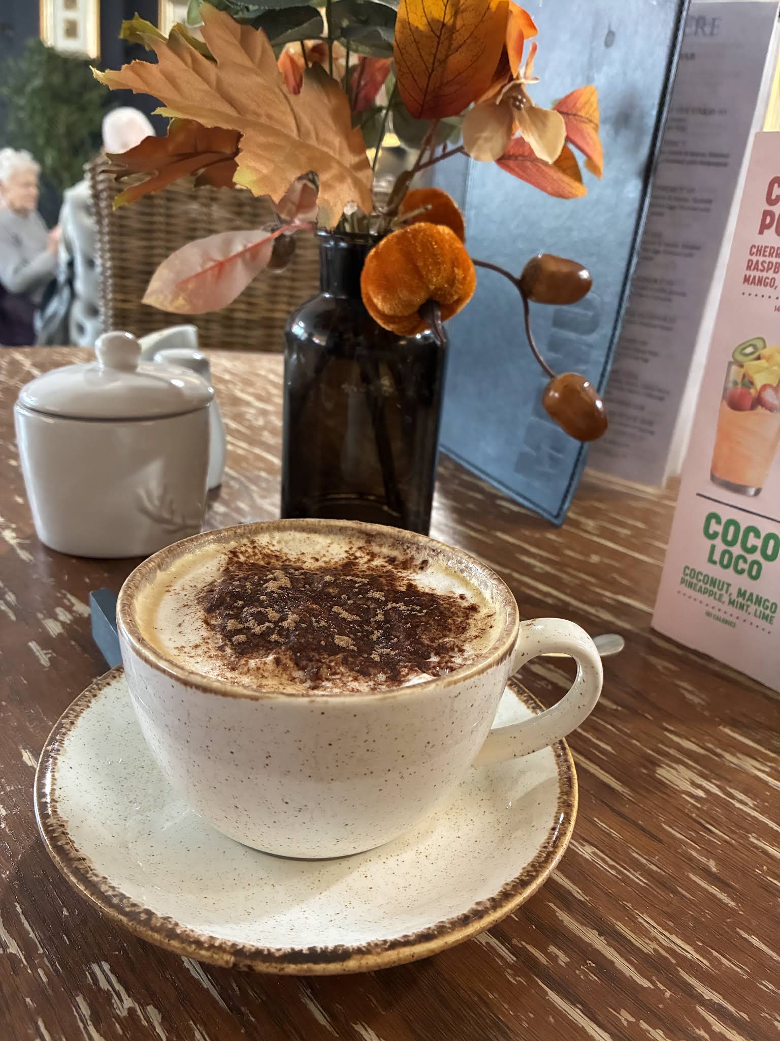 A complete coffee cup and saucer on a table at Utopia